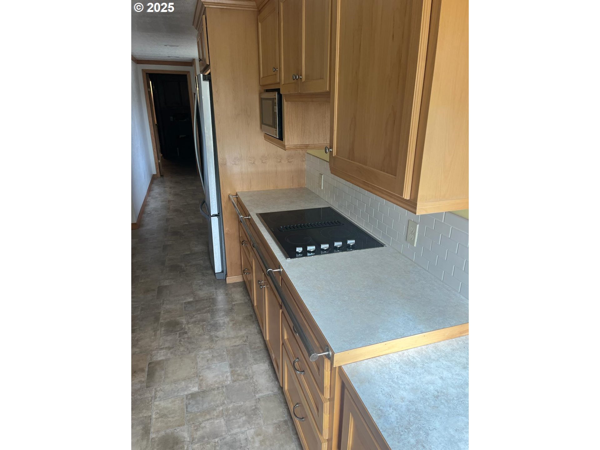 355 West Washington Street Athena, OR 97813 - Photo 14 of 32 a kitchen with a sink and cabinets