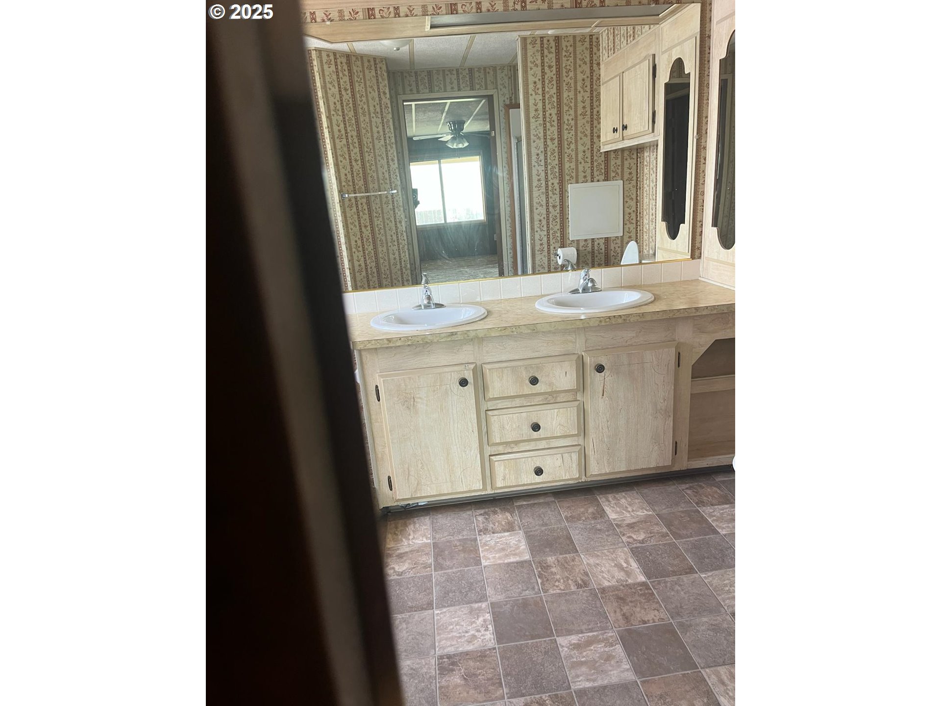 355 West Washington Street Athena, OR 97813 - Photo 28 of 32 a bathroom with a granite countertop sink a toilet and a mirror