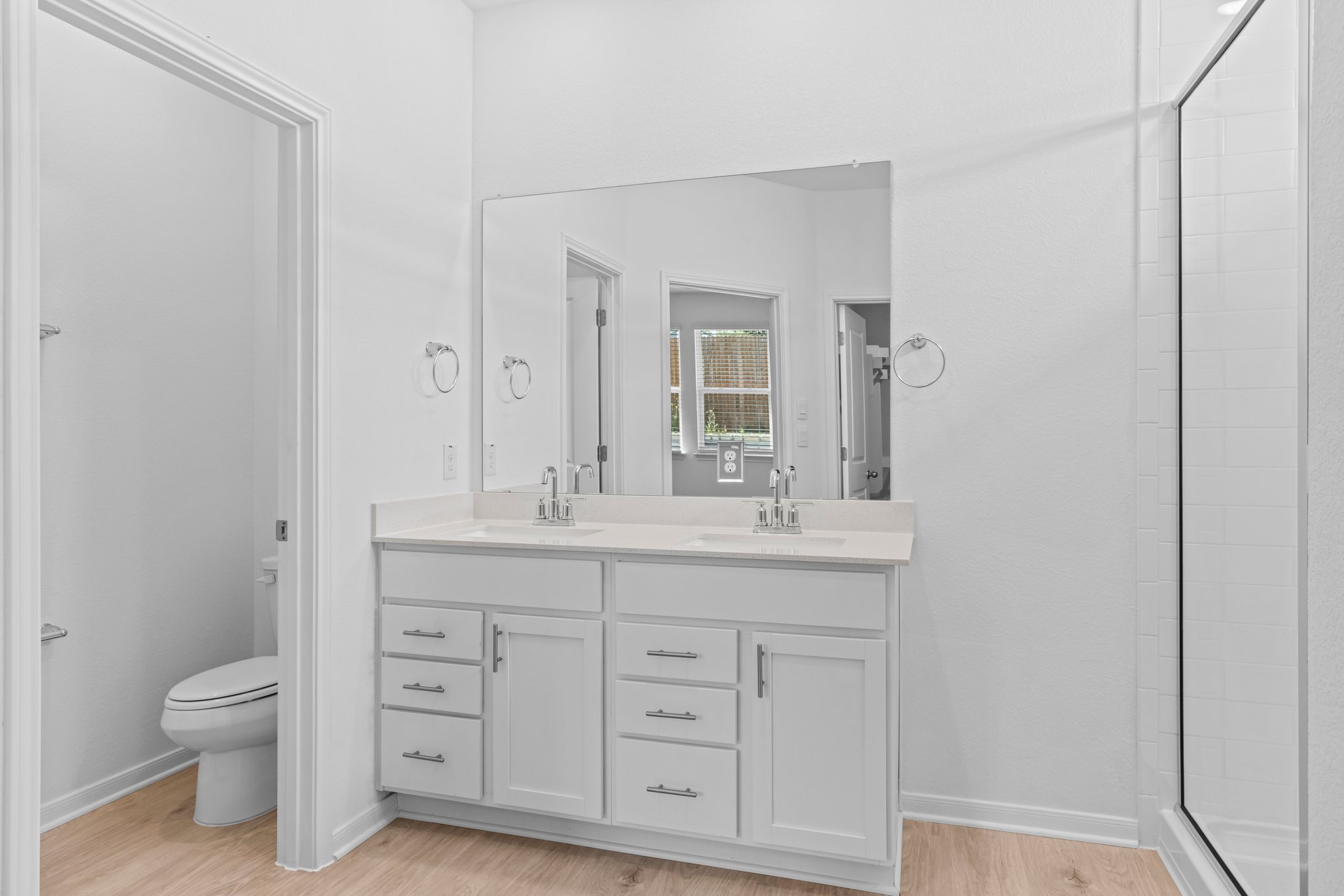 305 Brooks Ranch Drive Kyle, TX 78640 - Photo 22 of 32 a spacious bathroom with a granite countertop sink a toilet and a mirror