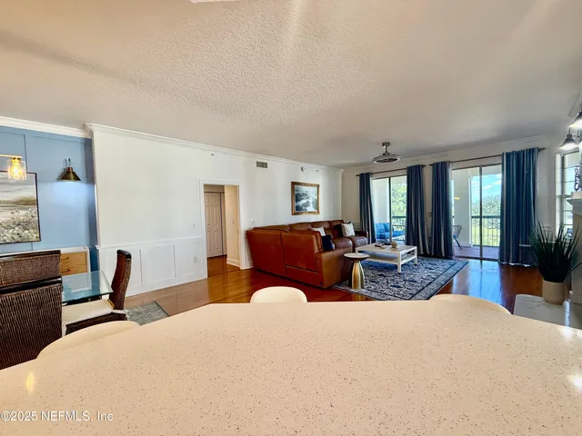 a bed room with furniture and a large window