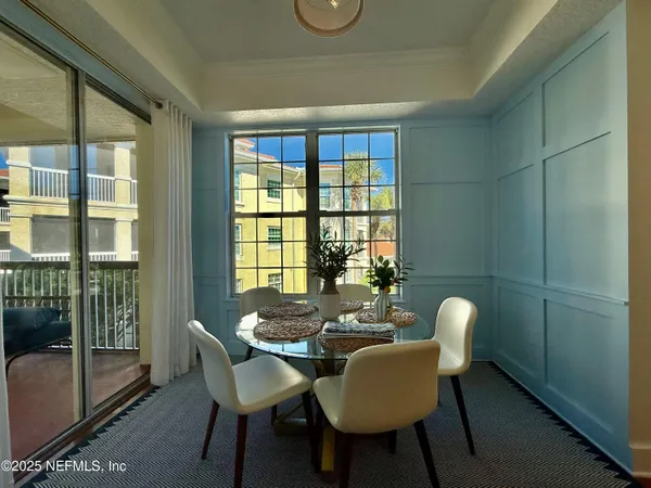 a view of a dining room with furniture window and outside view