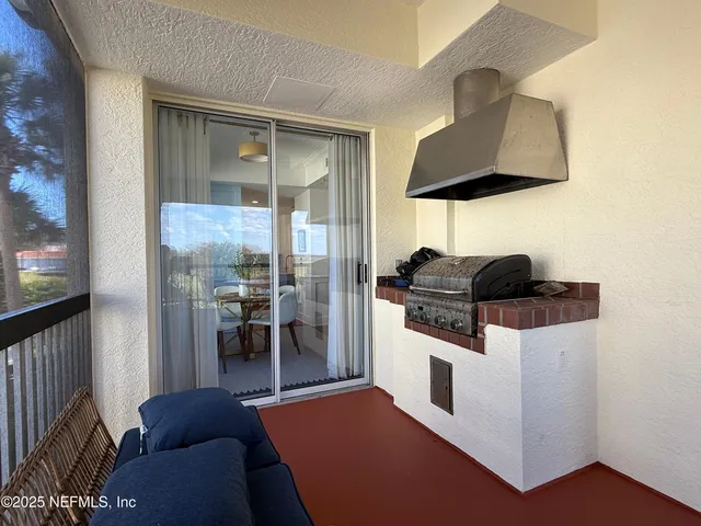 a living room with furniture and a lamp