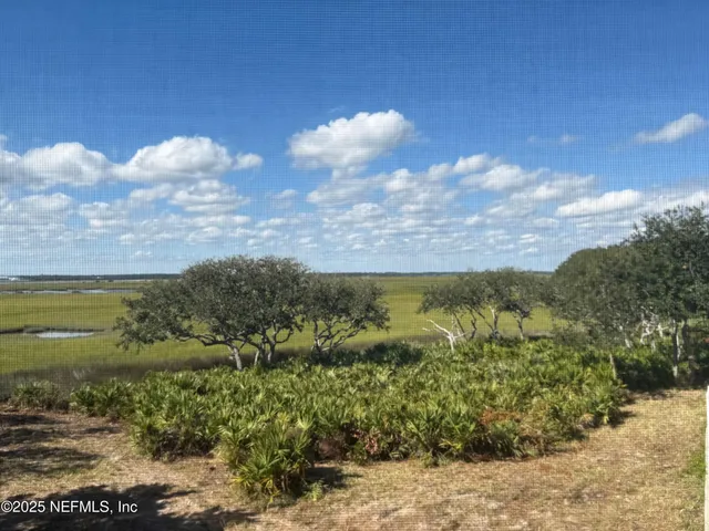 a view of a lake with mountains in the background