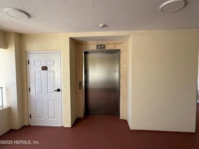 an empty room with closet area