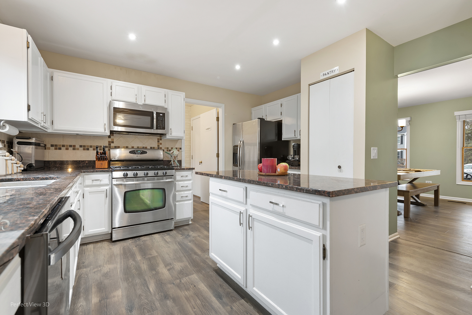 2001 Madison Avenue Gurnee, IL 60031 - Photo 4 of 26 a kitchen with kitchen island granite countertop a sink cabinets and stainless steel appliances