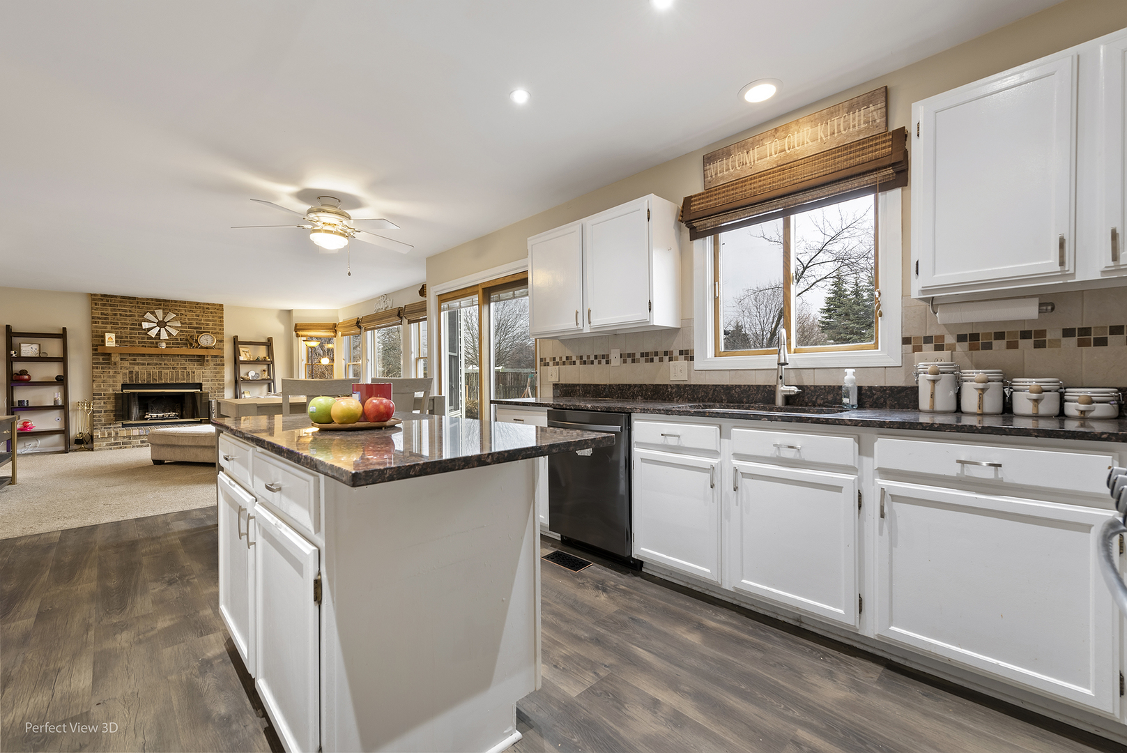 2001 Madison Avenue Gurnee, IL 60031 - Photo 5 of 26 a kitchen with kitchen island granite countertop a sink appliances cabinets and a counter top space