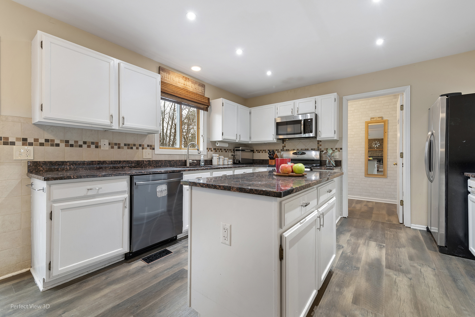 2001 Madison Avenue Gurnee, IL 60031 - Photo 6 of 26 a kitchen with granite countertop a sink stove top oven and refrigerator