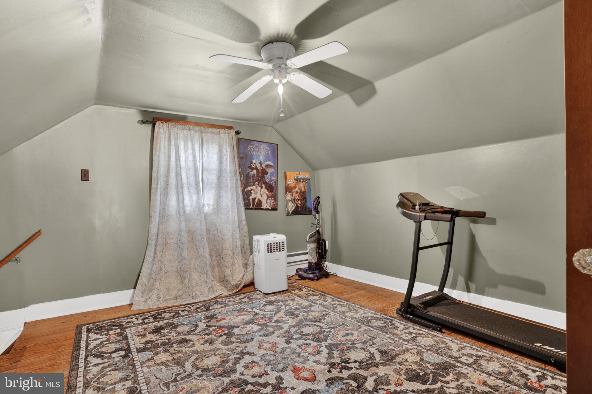 7278 Fleming Road New Church, VA 23415 - Photo 26 of 44 a very nice looking room with a bed and a chandelier