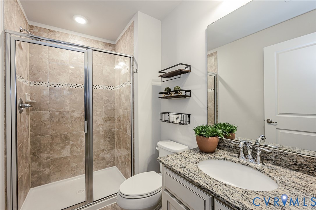 7435 Wicks Road Williamsburg, VA 23188 - Photo 68 of 82 Basement Bathroom featuring a glass-enclosed showe