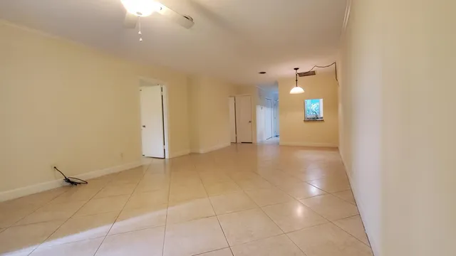 a view of a big room with windows and cabinet