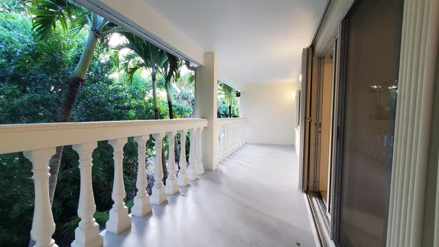 a view of swimming pool from a balcony