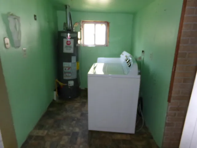 a bathroom with a tub and toilet