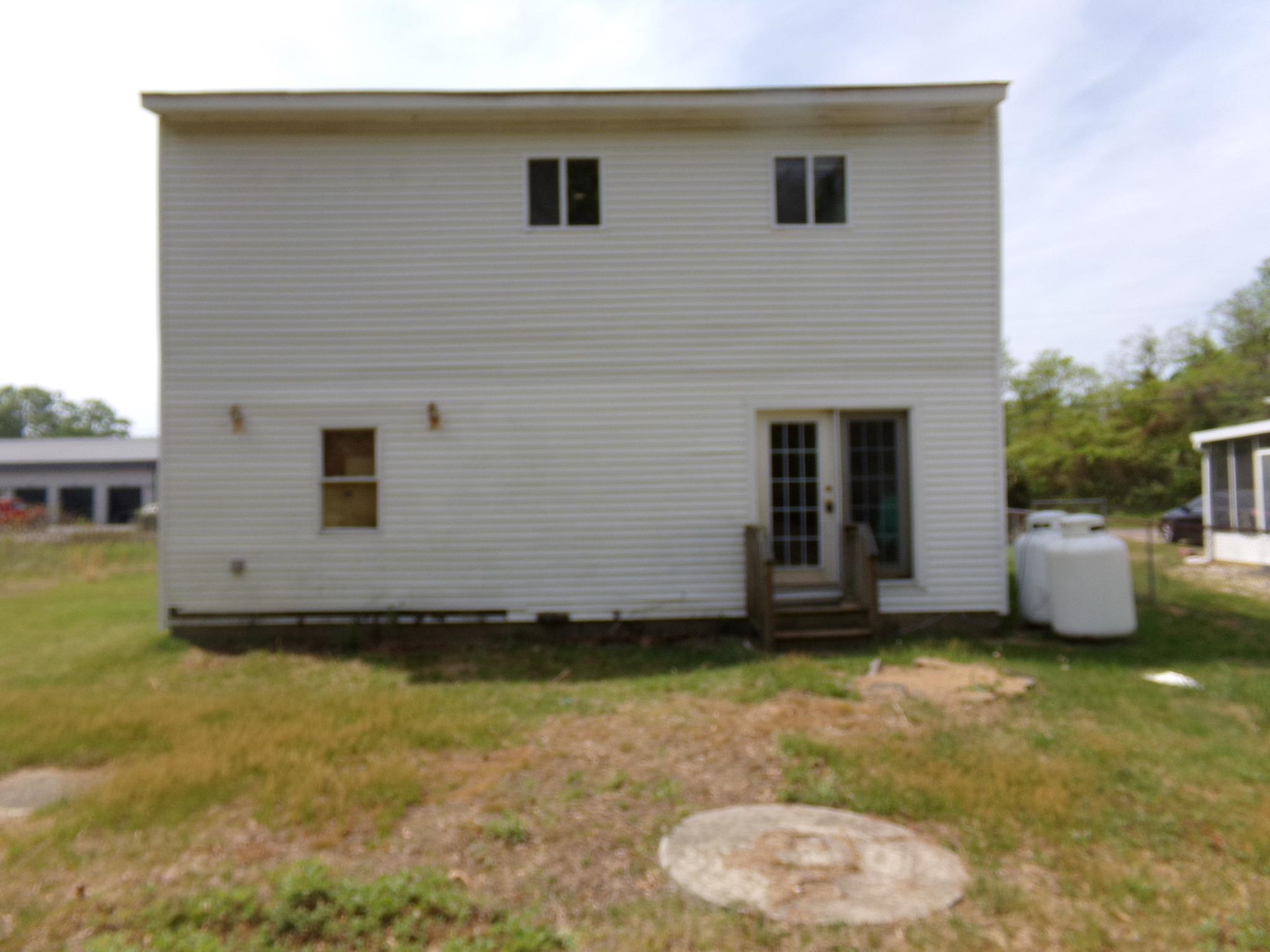 14 Gibson Avenue Whitesboro, NJ 08210 - Photo 3 of 25 a view of a backyard with a garden and plants