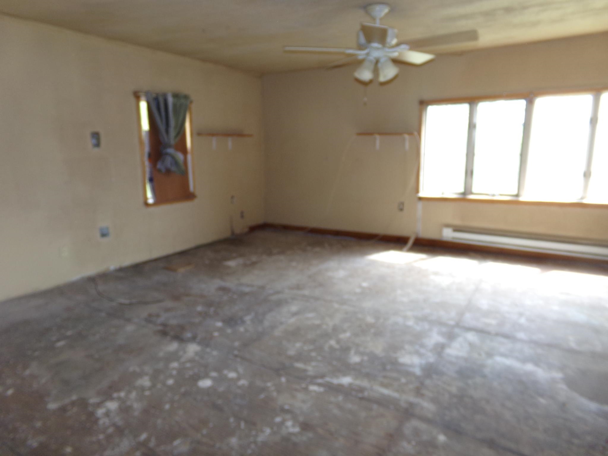 14 Gibson Avenue Whitesboro, NJ 08210 - Photo 7 of 25 an empty room with windows and ceiling fan