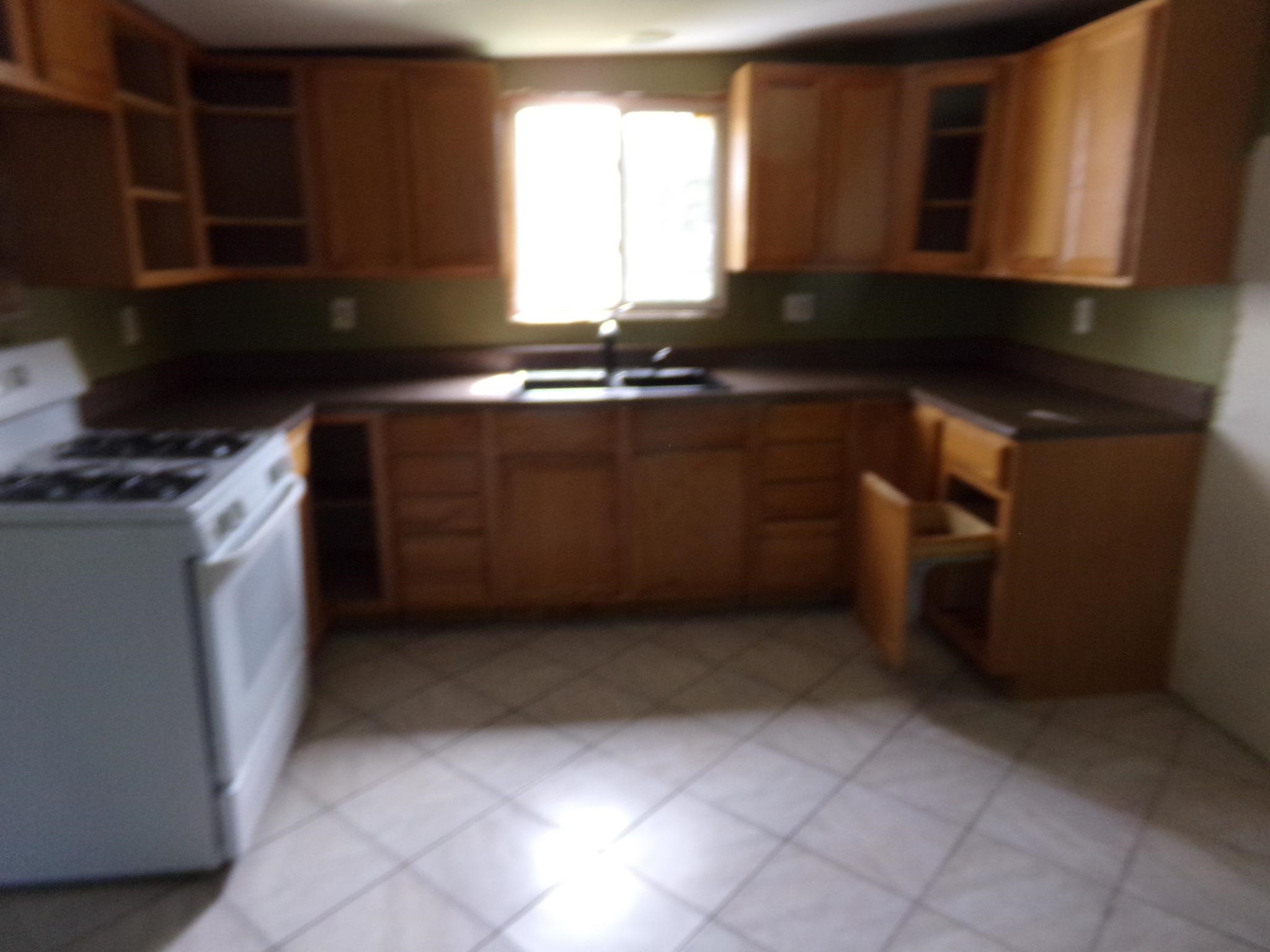 14 Gibson Avenue Whitesboro, NJ 08210 - Photo 9 of 25 a kitchen with a sink a stove and cabinets