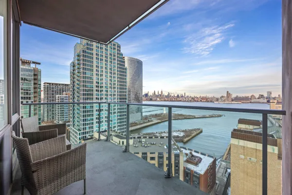 a balcony with a water view