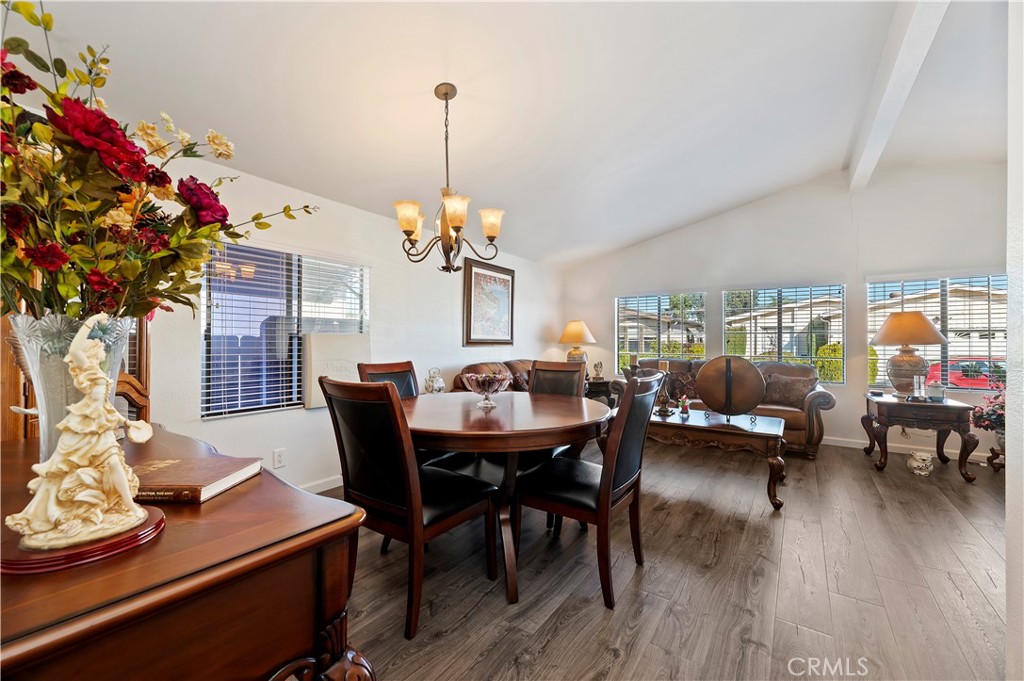 27250 Murrieta Road, Unit 120 Menifee, CA 92586 - Photo 11 of 46 a view of a dining room with furniture and wooden floor
