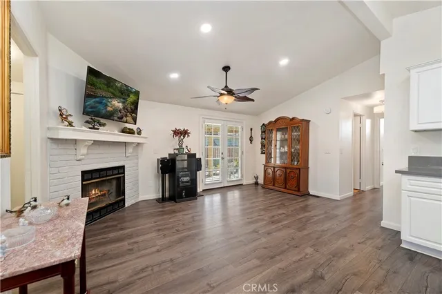 a living room with furniture fireplace and flat screen tv