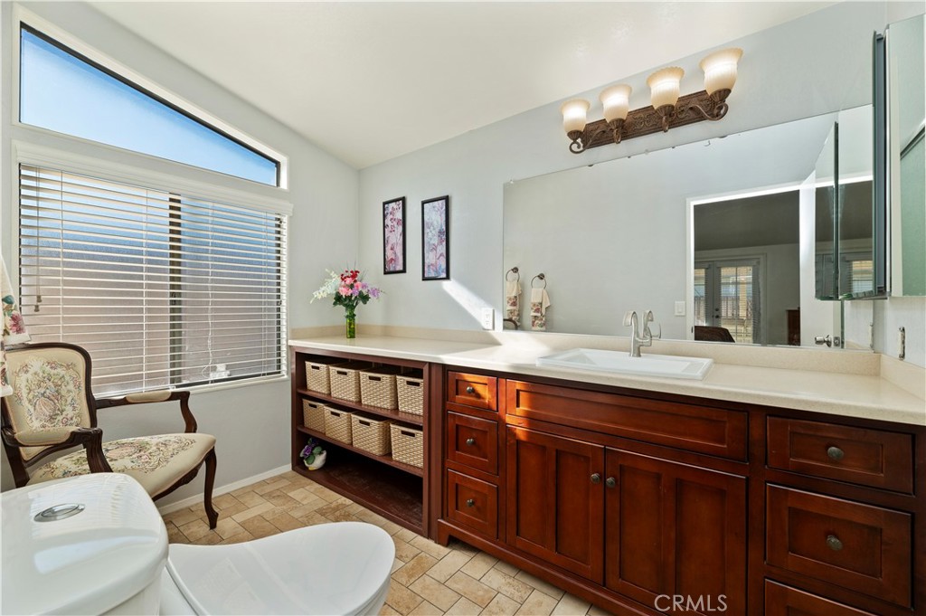 27250 Murrieta Road, Unit 120 Menifee, CA 92586 - Photo 22 of 46 a bathroom with a sink and a mirror