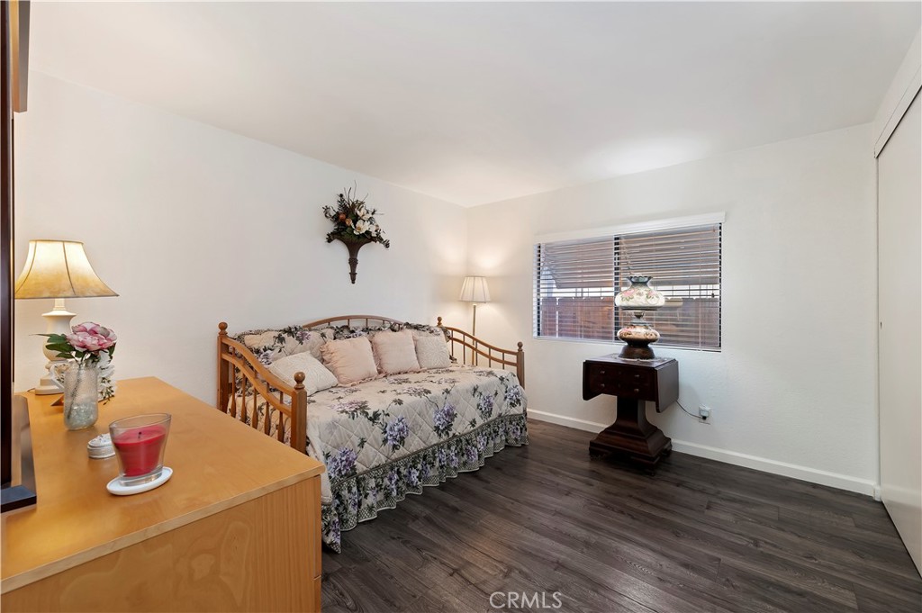 27250 Murrieta Road, Unit 120 Menifee, CA 92586 - Photo 24 of 46 a bedroom with bed and wooden floor