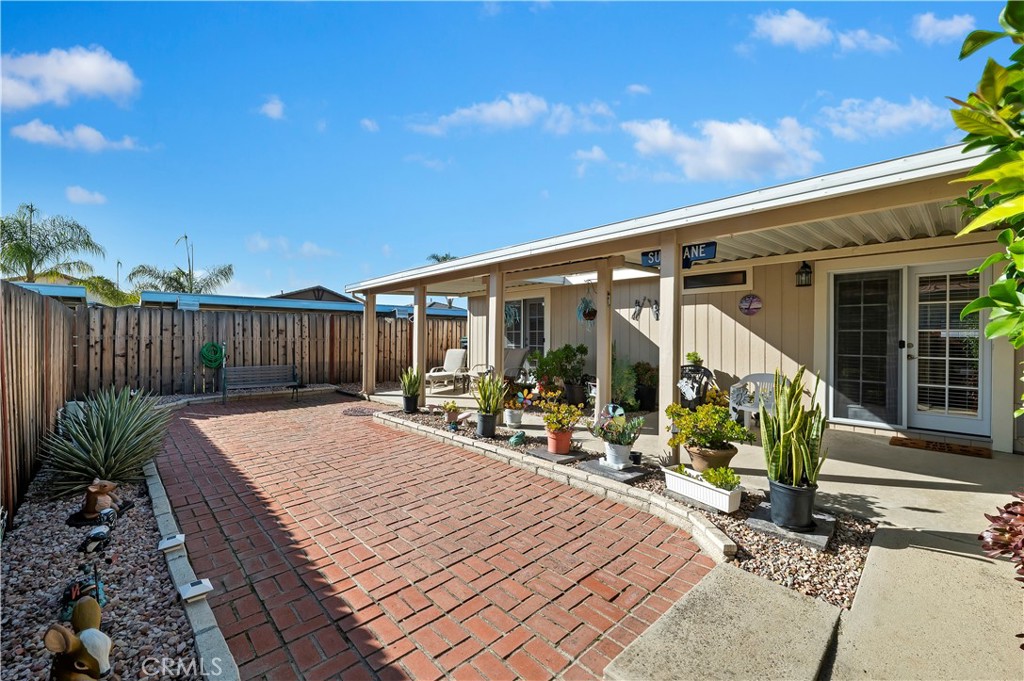 27250 Murrieta Road, Unit 120 Menifee, CA 92586 - Photo 27 of 46 a view of a dinning table and chairs in patio