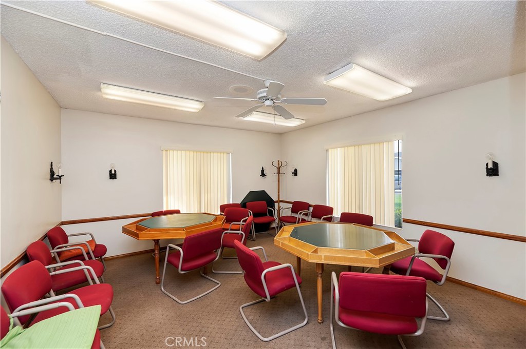 27250 Murrieta Road, Unit 120 Menifee, CA 92586 - Photo 37 of 46 a bedroom with furniture and a couch