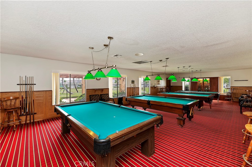27250 Murrieta Road, Unit 120 Menifee, CA 92586 - Photo 38 of 46 a room with pool table wooden floor and windows