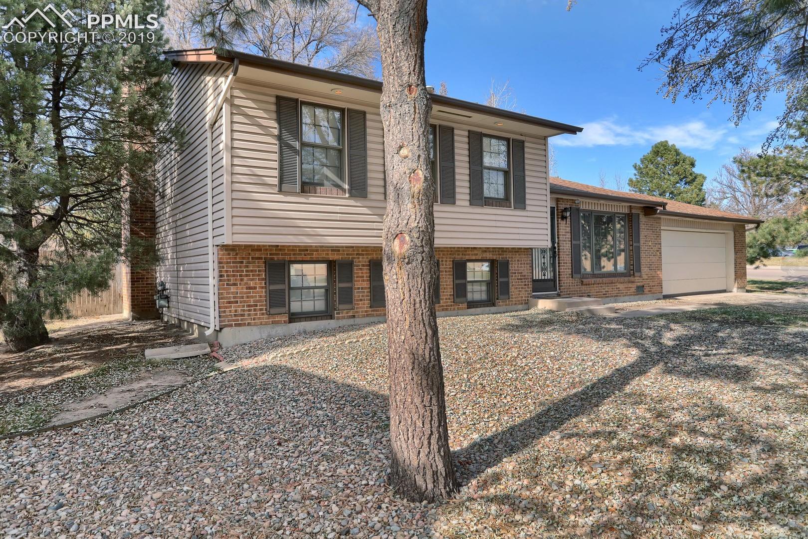 2409 Ranch Lane Colorado Springs, CO 80918 - Photo 2 of 25 Home is located in established neighborhood close to shopping and dining.