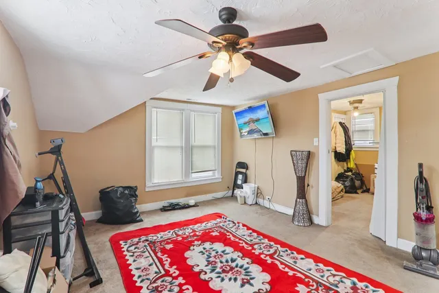 a bedroom with furniture and a window