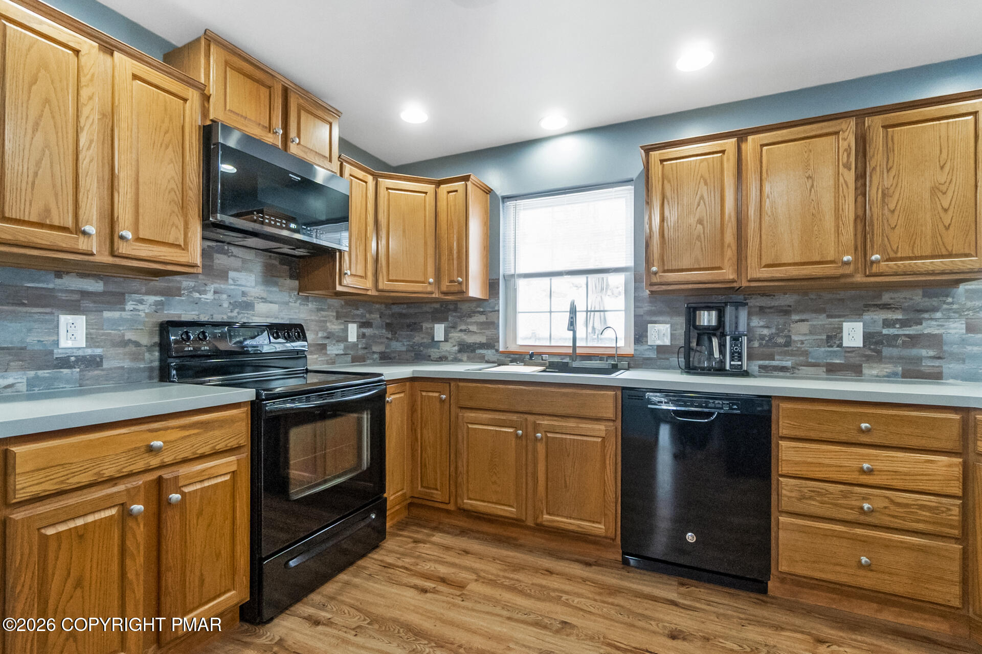 95 Benns Hill Road Bangor, PA 18013 - Photo 15 of 70 a kitchen with granite countertop wooden cabinets stainless steel appliances a sink and a window