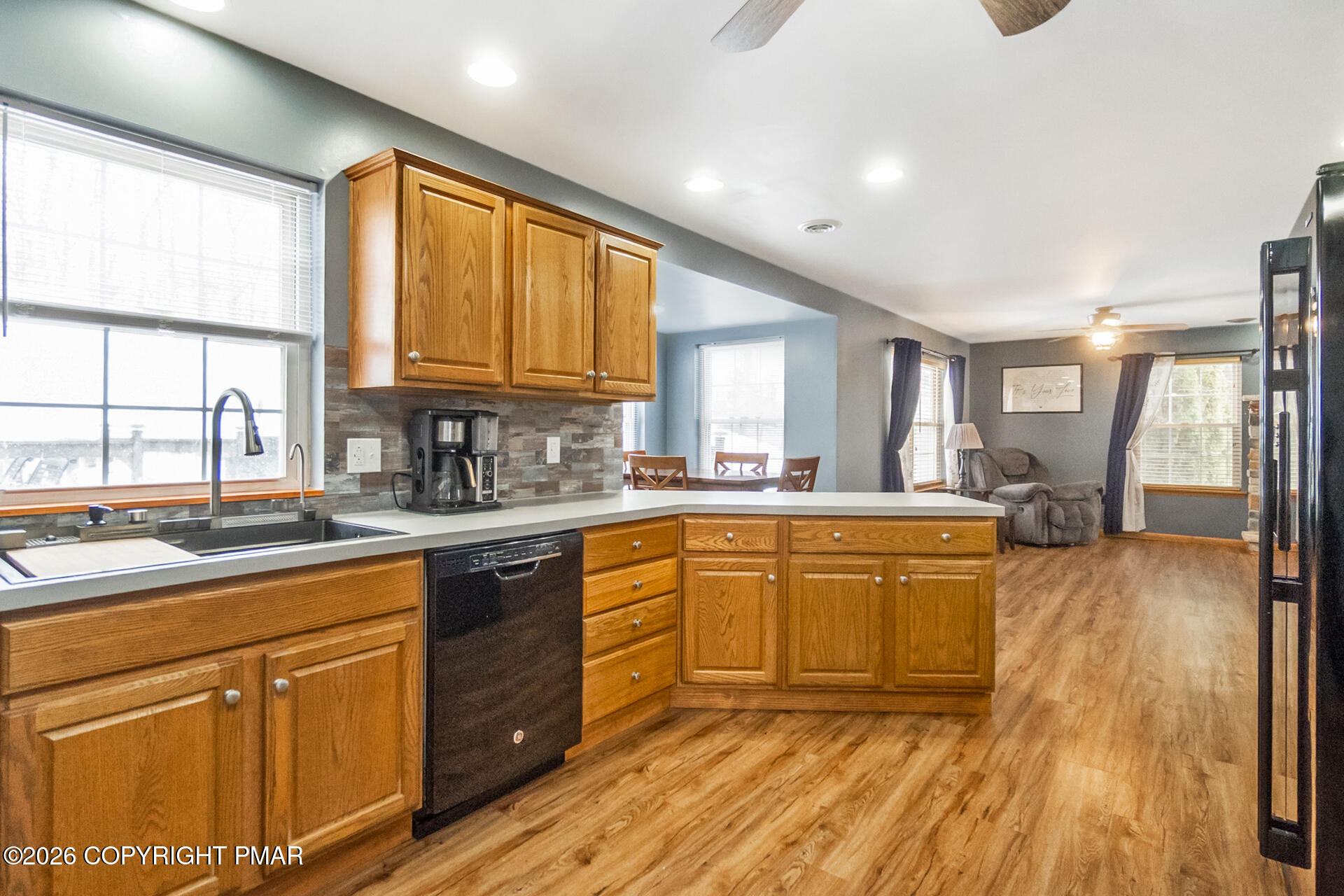 95 Benns Hill Road Bangor, PA 18013 - Photo 19 of 70 a large kitchen with kitchen island granite countertop a stove a sink dishwasher and white cabinets with wooden floor