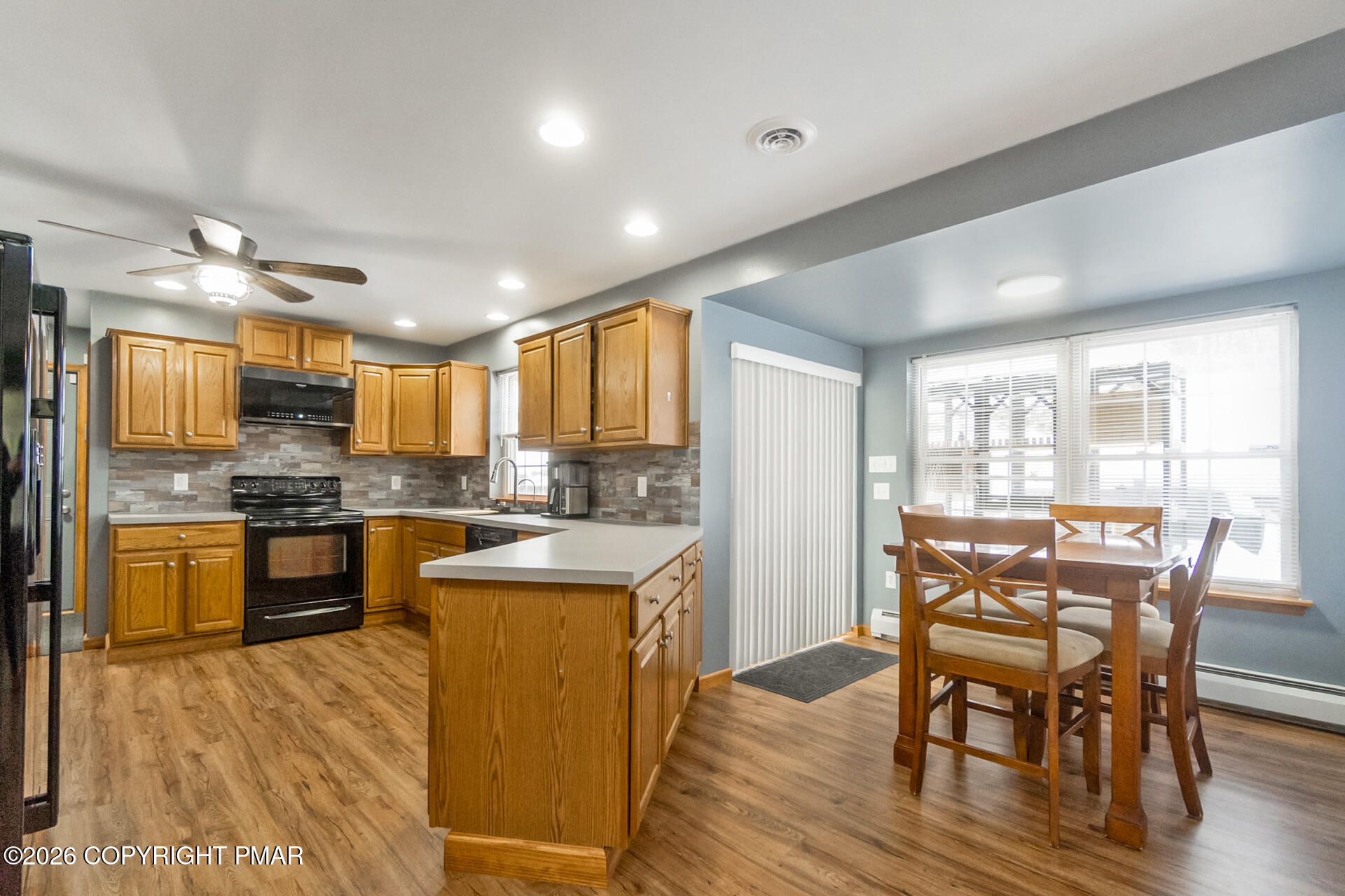 95 Benns Hill Road Bangor, PA 18013 - Photo 22 of 70 a kitchen with a table chairs refrigerator and cabinets