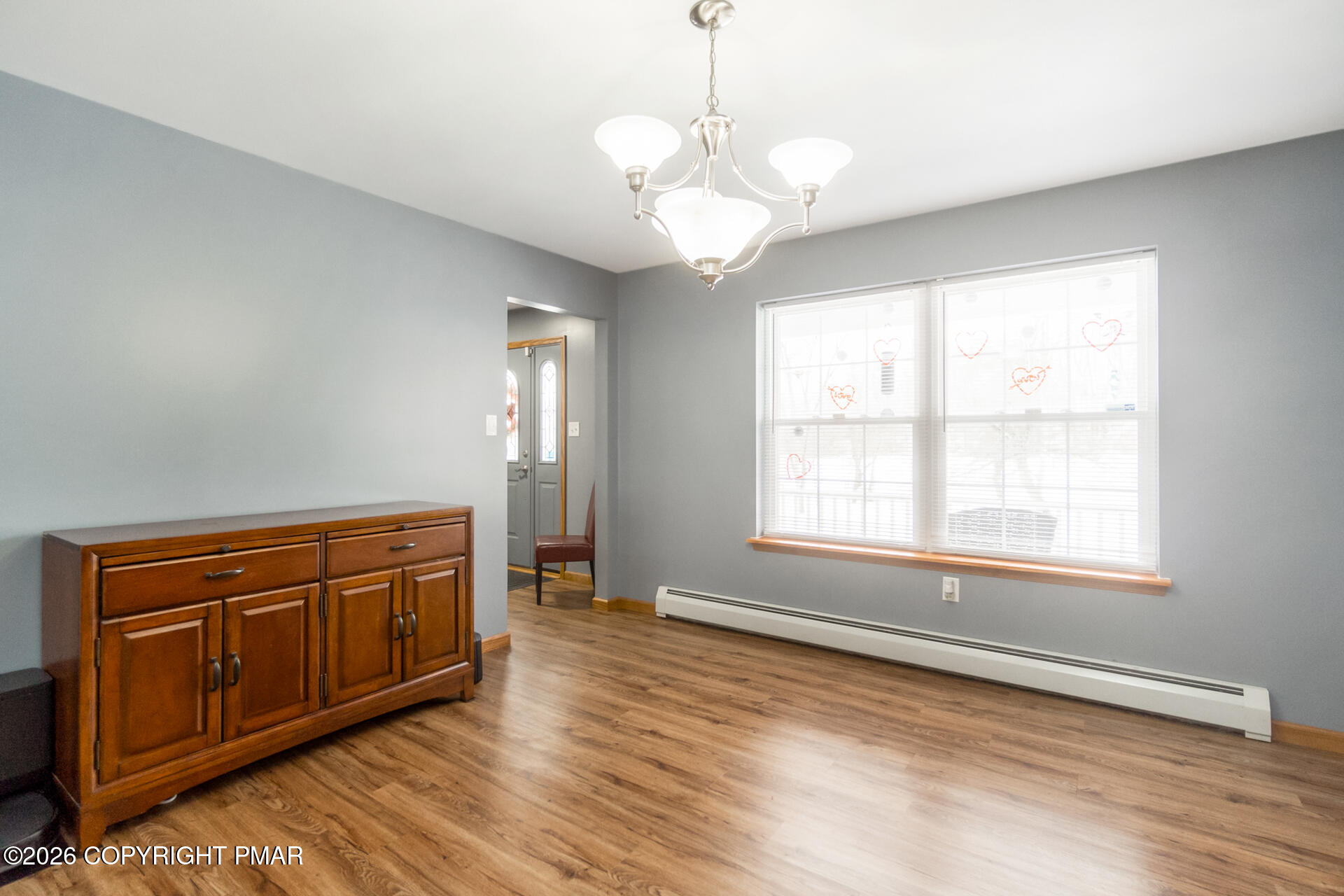 95 Benns Hill Road Bangor, PA 18013 - Photo 35 of 70 a view of a livingroom with a chandelier wooden floor and windows
