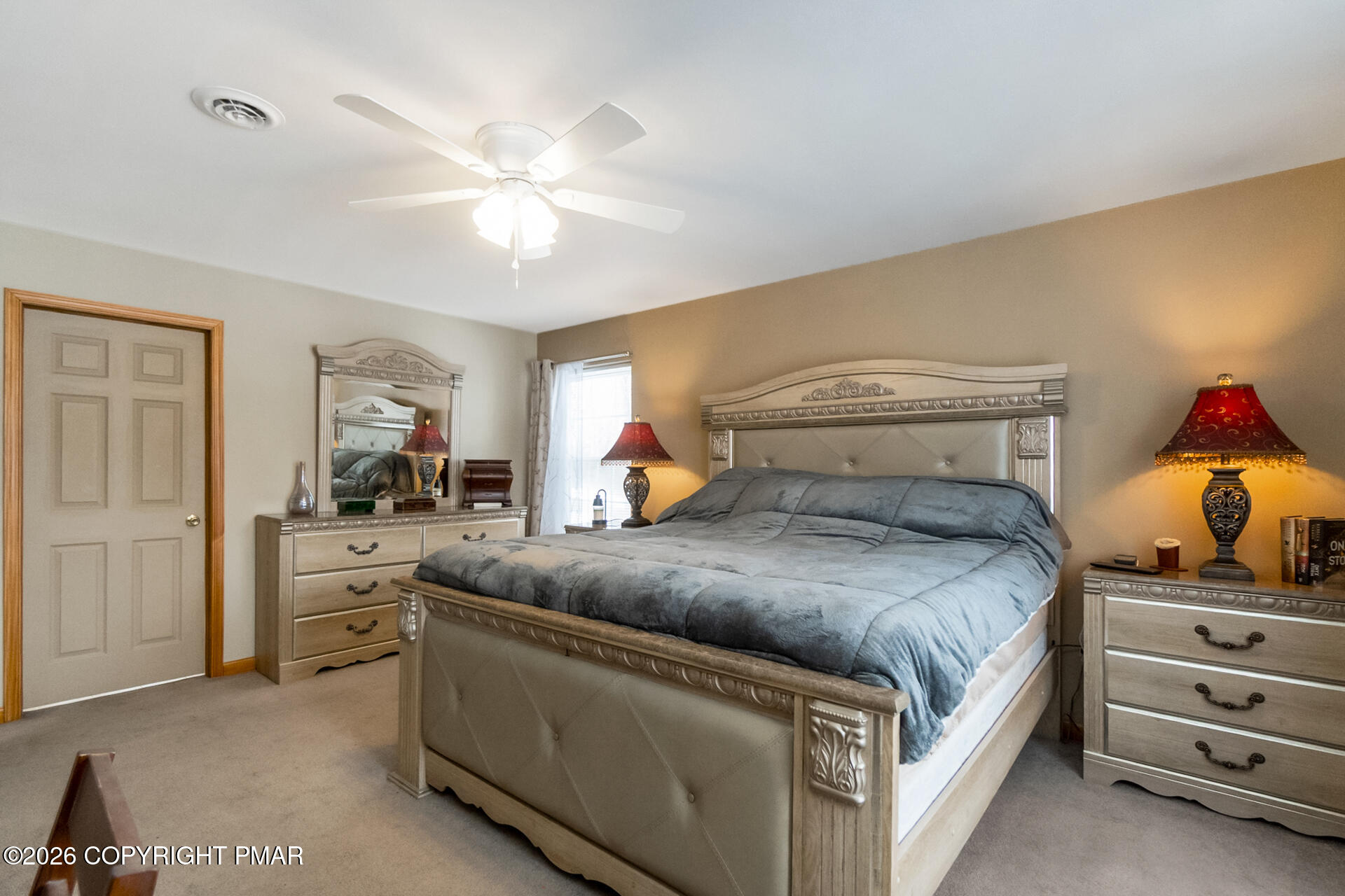 95 Benns Hill Road Bangor, PA 18013 - Photo 41 of 70 a bedroom with a bed and a chandelier fan