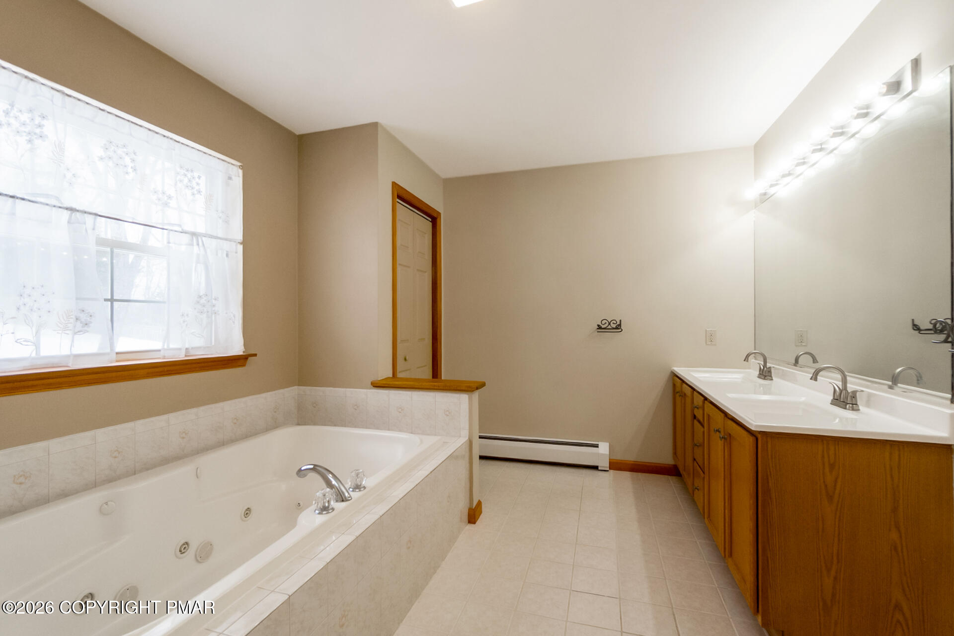 95 Benns Hill Road Bangor, PA 18013 - Photo 44 of 70 a bathroom with a tub sink and mirror