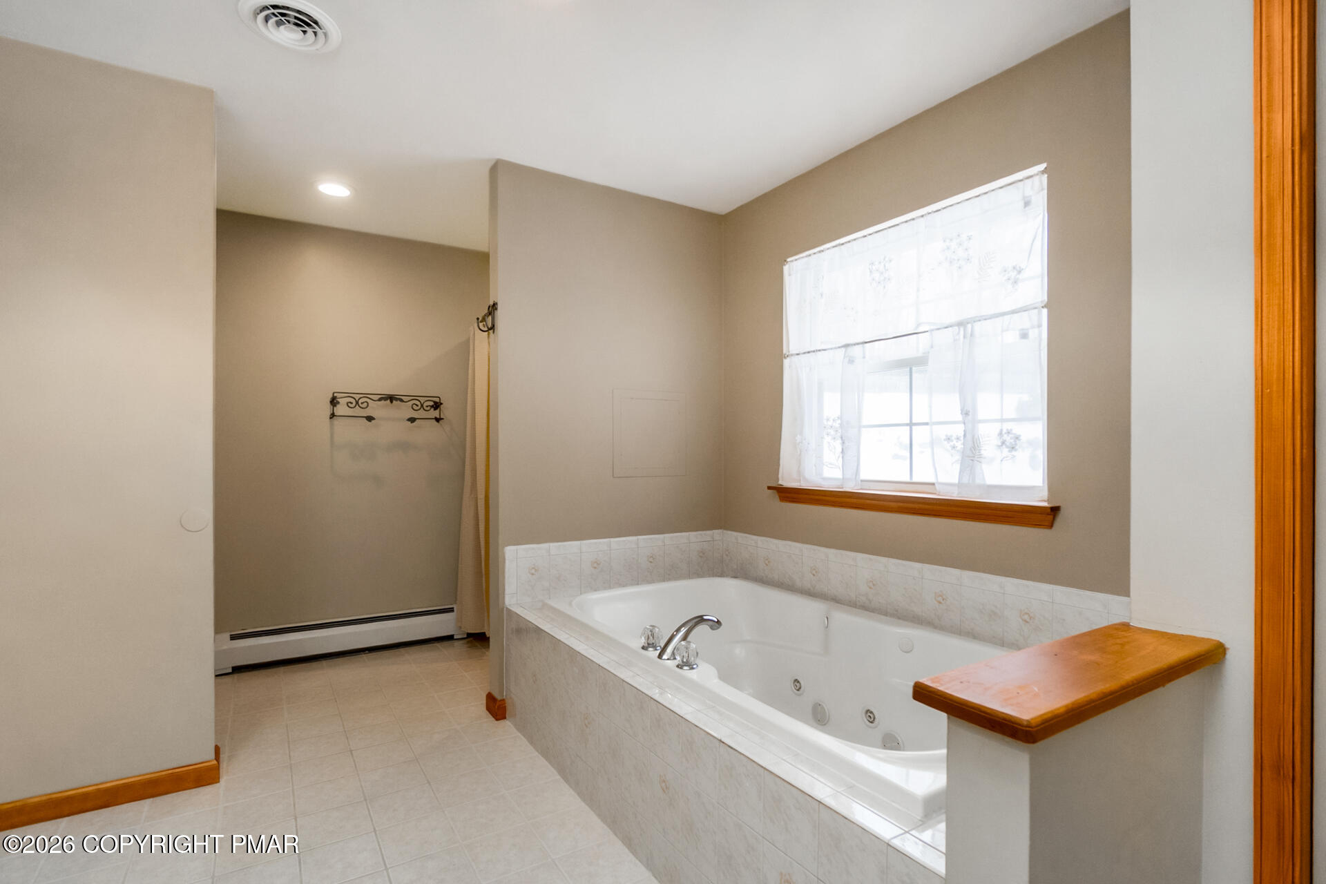 95 Benns Hill Road Bangor, PA 18013 - Photo 46 of 70 a bathroom with a bathtub and a window