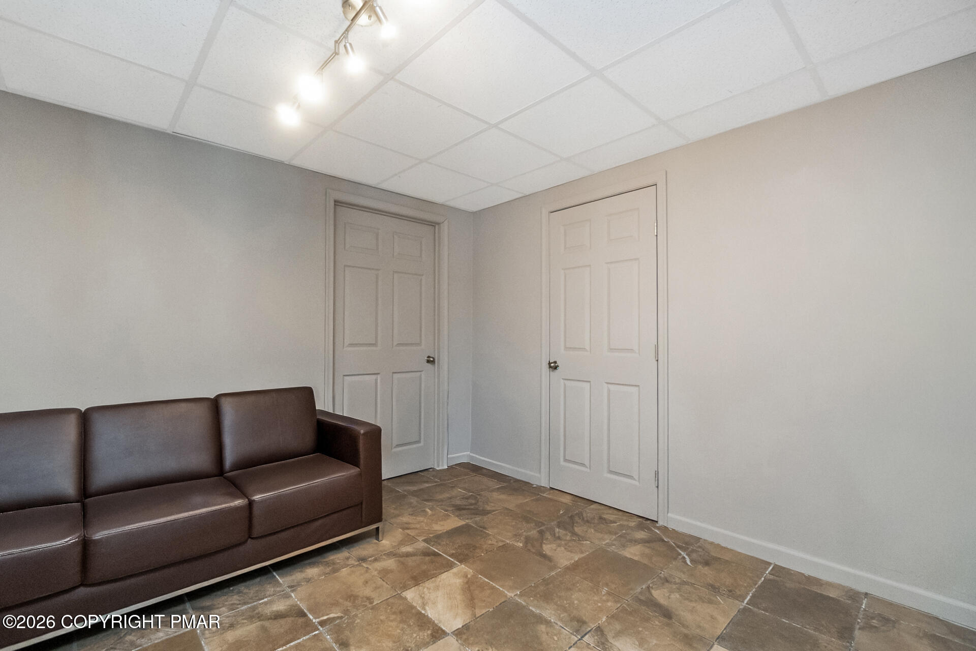 95 Benns Hill Road Bangor, PA 18013 - Photo 67 of 70 a living room with a couch and a ceiling fan