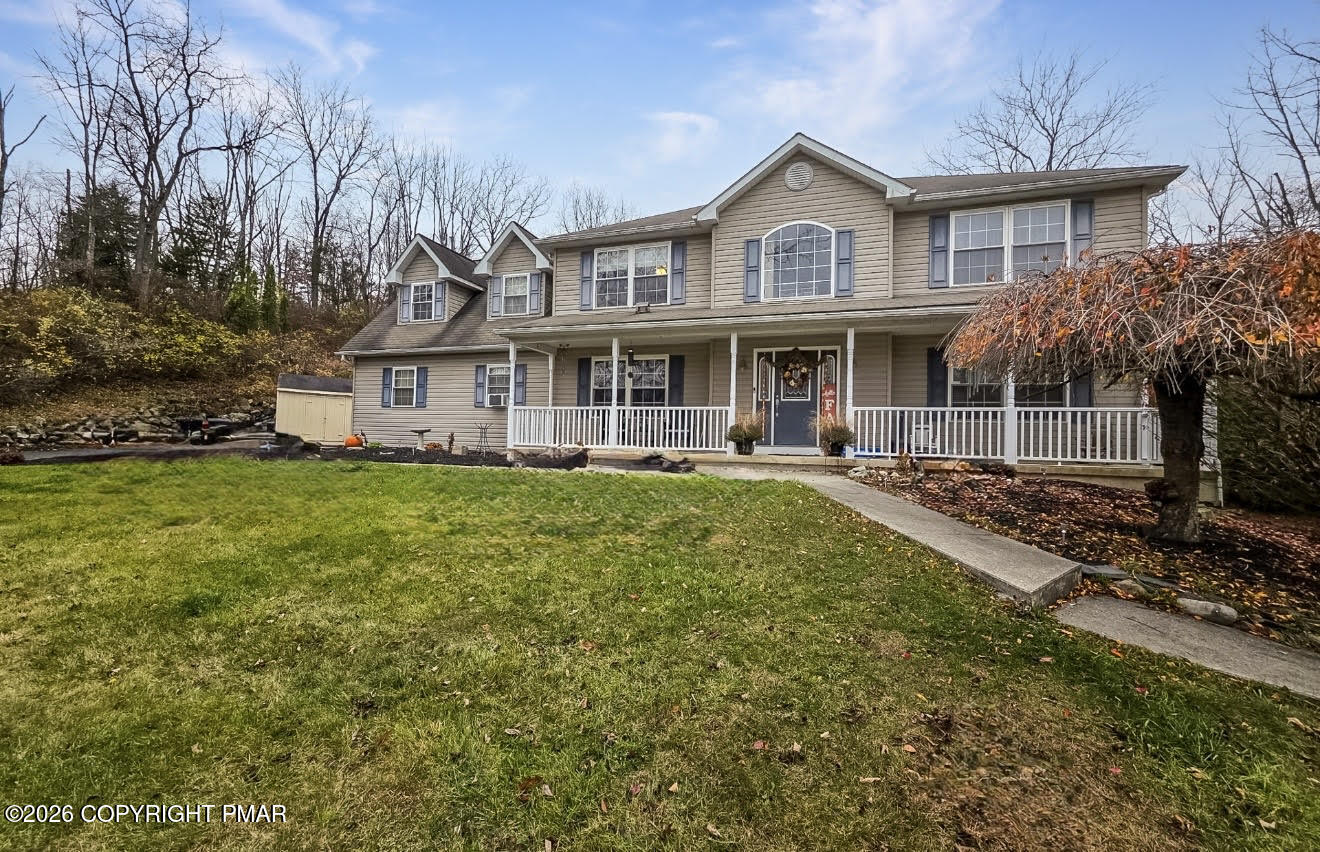 95 Benns Hill Road Bangor, PA 18013 - Photo 9 of 70 a front view of a house with a garden and trees