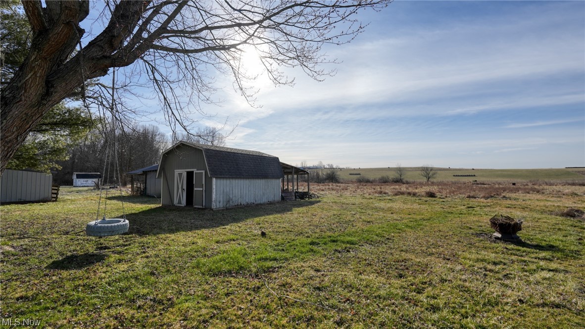 59062 Marietta Road Byesville, OH 43723 - Photo 25 of 33 View of yard with a rural view and a storage shed