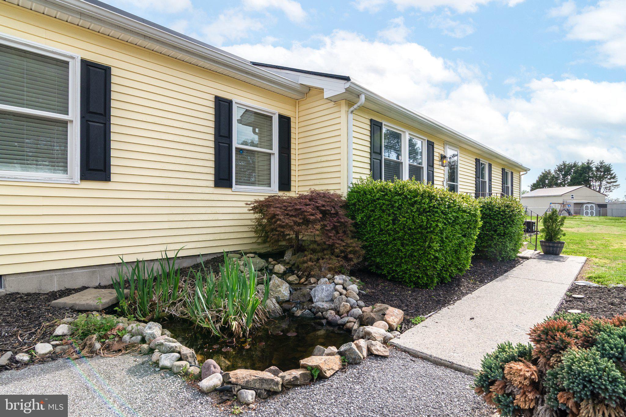 14788 Josephs Road Seaford, DE 19973 - Photo 3 of 25 Charming home with serene pond view.