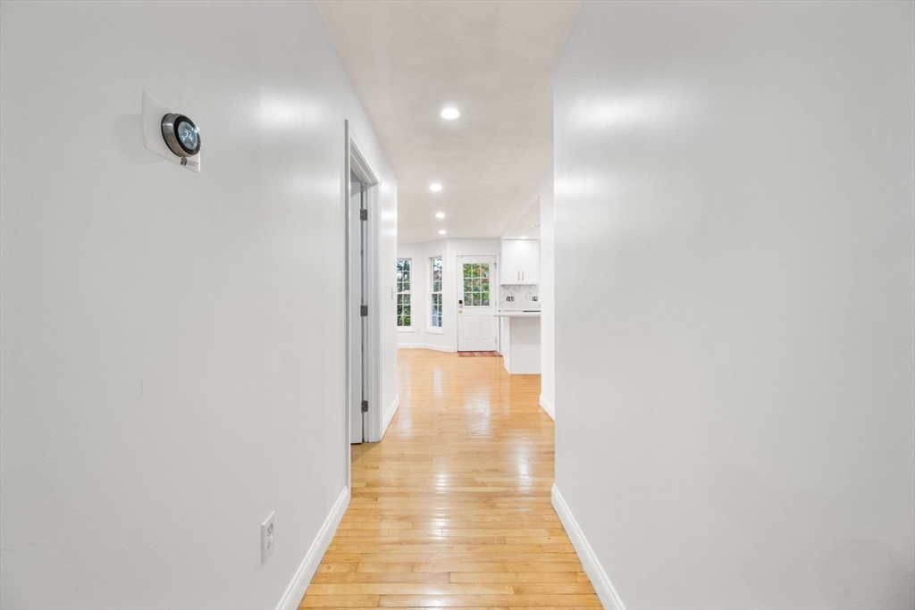 772 Main Street, Unit 2 Wakefield, MA 01880 - Photo 11 of 30 a view of a hallway with wooden floor