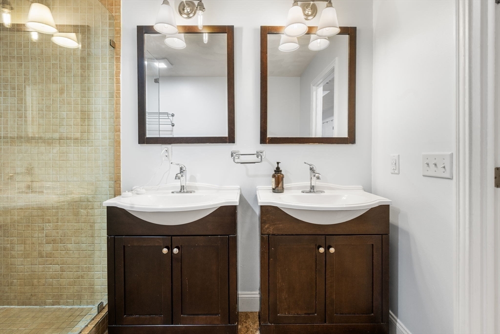 772 Main Street, Unit 2 Wakefield, MA 01880 - Photo 14 of 30 a bathroom with a double vanity sink and a mirror