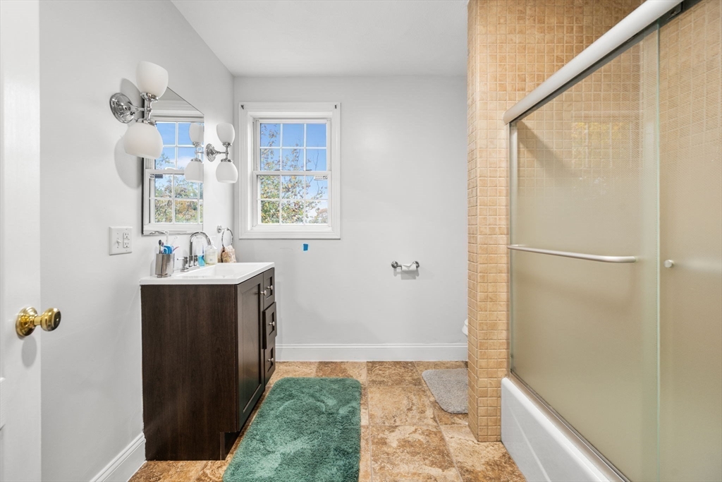 772 Main Street, Unit 2 Wakefield, MA 01880 - Photo 17 of 30 a bathroom with a sink and a mirror