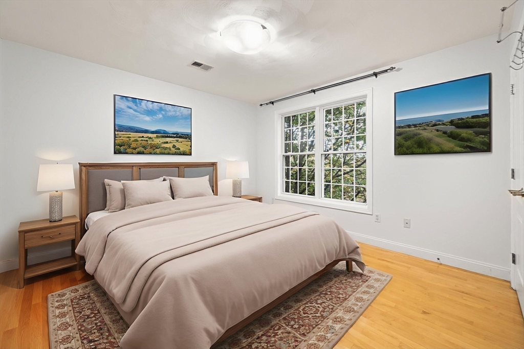 772 Main Street, Unit 2 Wakefield, MA 01880 - Photo 18 of 30 a bedroom with a bed and a window
