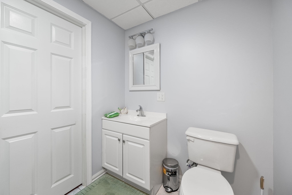772 Main Street, Unit 2 Wakefield, MA 01880 - Photo 25 of 30 a white toilet sitting next to a bathroom sink