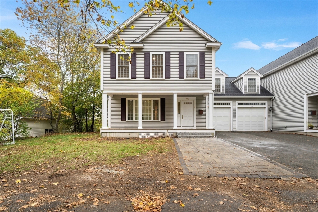772 Main Street, Unit 2 Wakefield, MA 01880 - Photo 4 of 30 a front view of a house with a yard