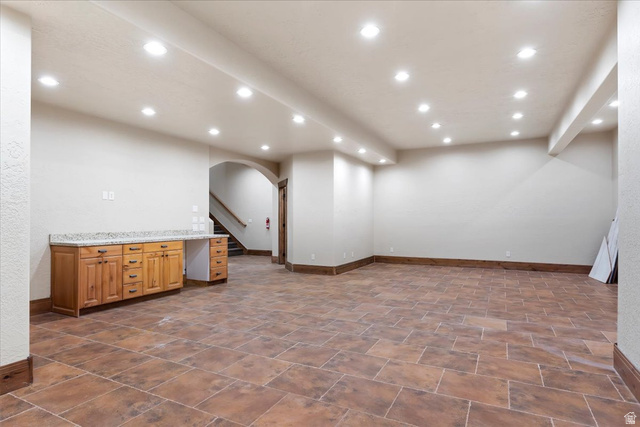 246 Woods Creek Road Morgan, UT 84050 - Photo 66 of 69 Spacious room featuring tile flooring, recessed lighting, and a built-in wood cabinet with a light-colored countertop