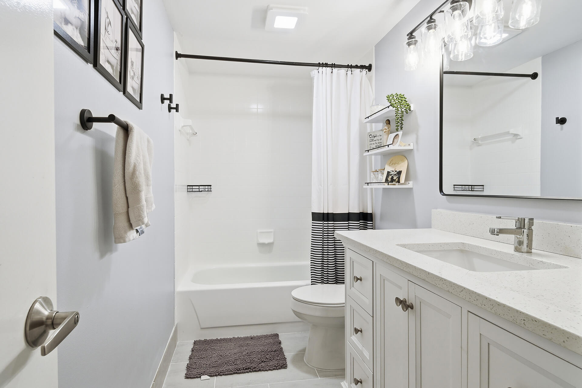 6818 68th Way West Palm Beach, FL 33409 - Photo 11 of 31 a bathroom with a sink a toilet and shower