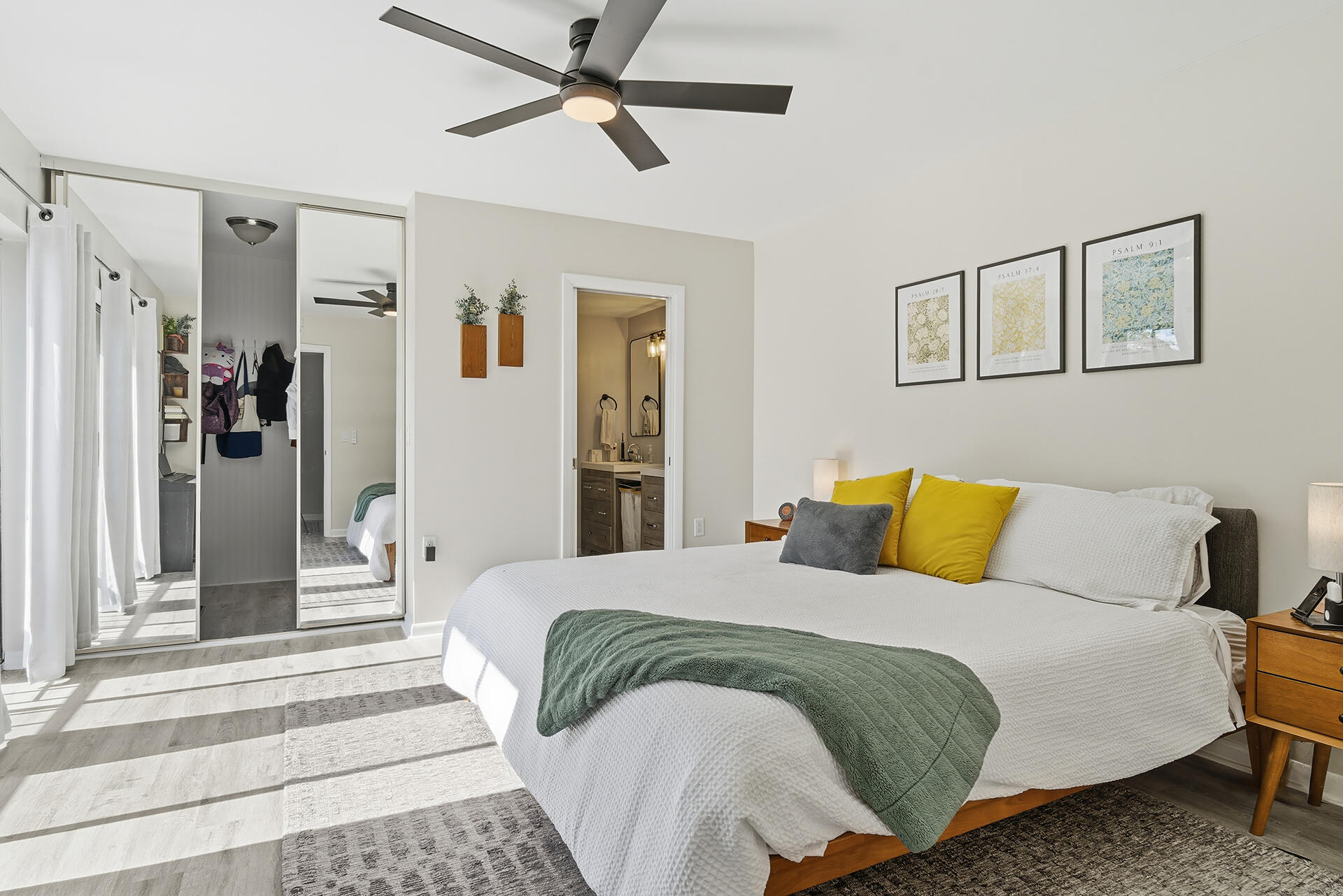 6818 68th Way West Palm Beach, FL 33409 - Photo 14 of 31 a bedroom with a bed and a chandelier