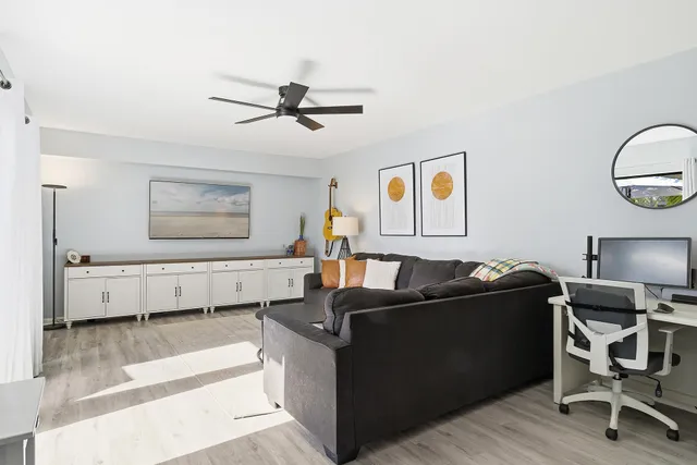 a kitchen with stainless steel appliances kitchen island a table and chairs in it